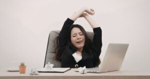 A person signing a loan agreement to get a signature loan fast with no collateral required