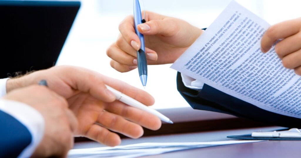 A person reviewing a short term signature loan offer for bad credit on a laptop at home.